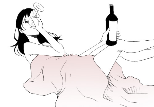 ベッドでお酒を飲む女性